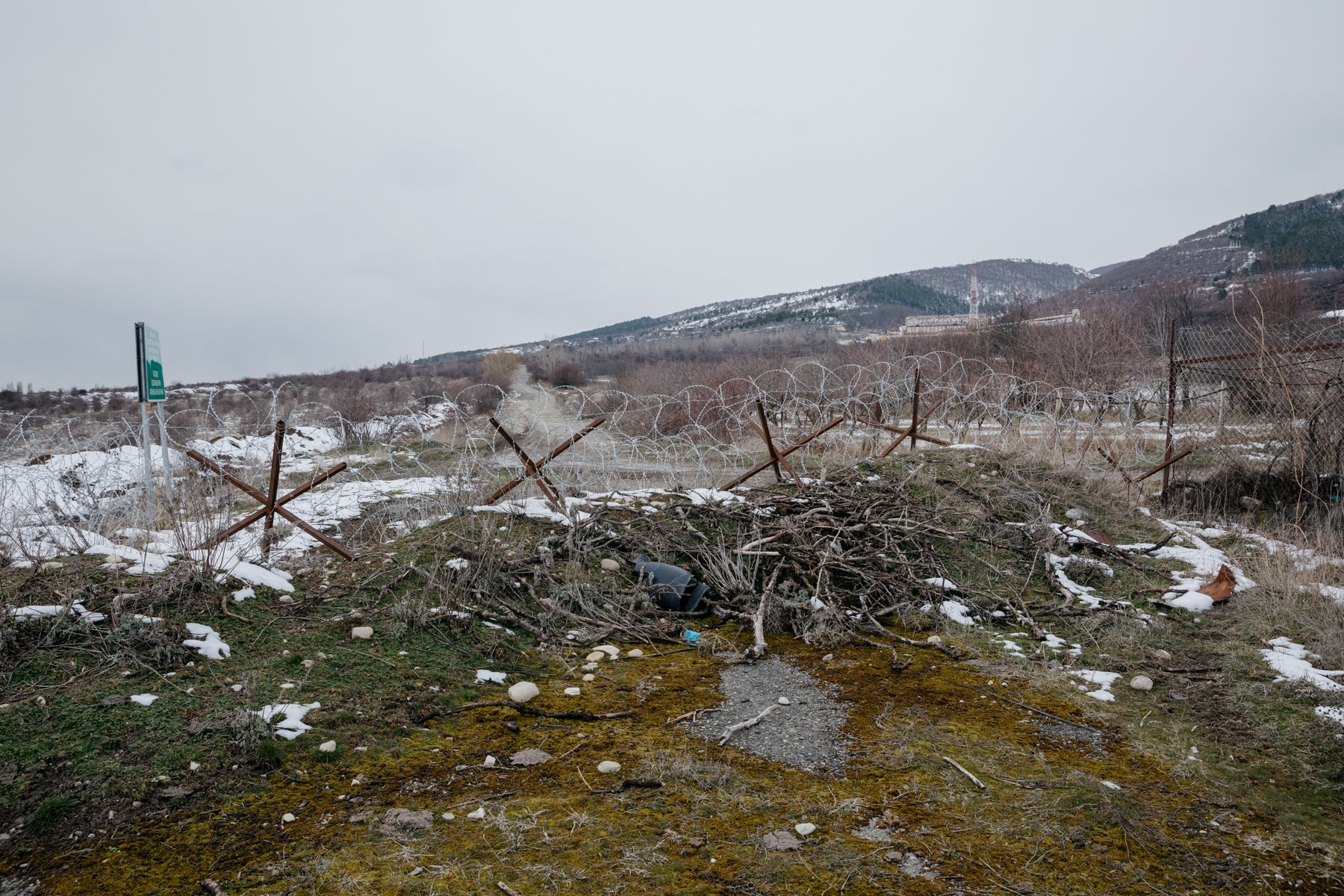  Border infrastructure on the western edge of Adzvi. A Russian base sits on the hill behind. 