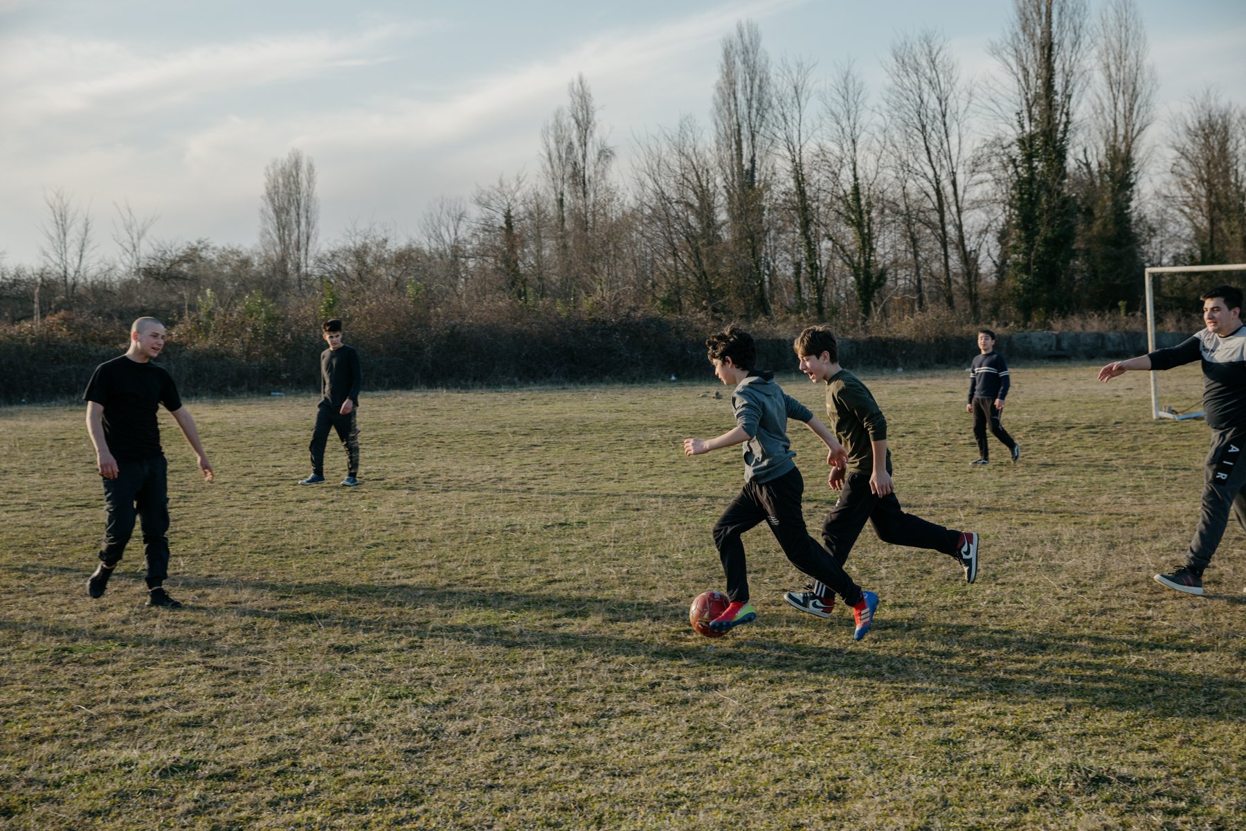  Boys play football in Shamgona, a village that lies a short distance from the nearest Russian troops on the other side of the Enguri River. 