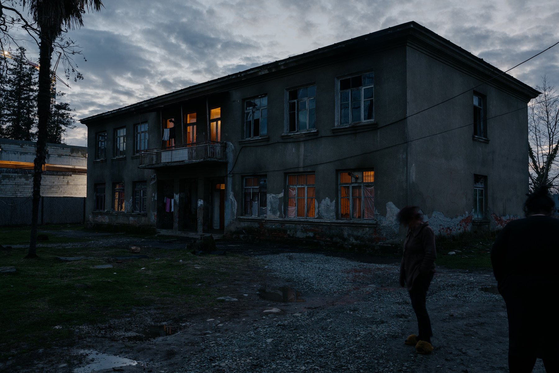  Women stand outside their IDP accommodation in the centre of Zugdidi. Many people have lived in poor conditions in buildings like this since they were displaced during the 1992-1993 Abkhaz War. 
