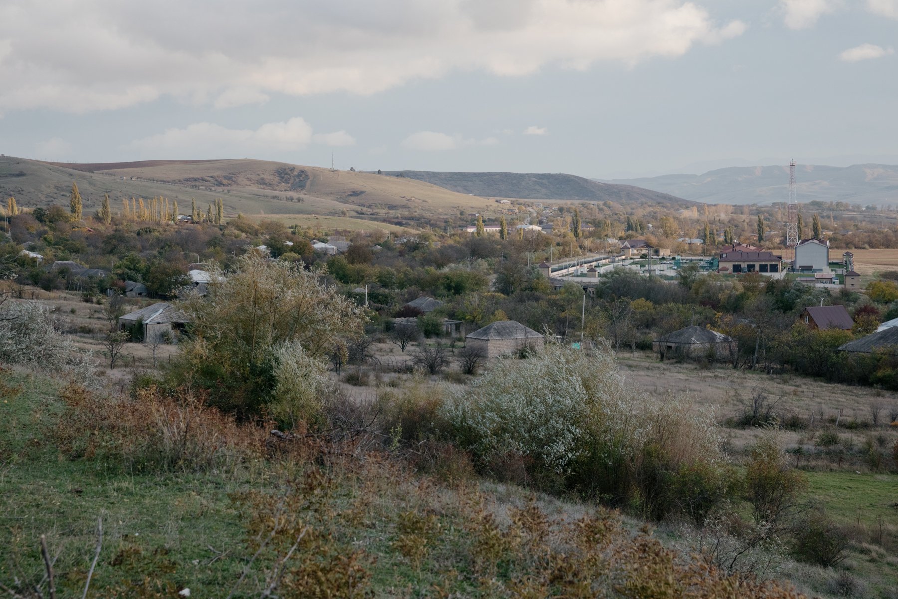  Abandoned houses on the occupation line near Bershueti. A Russian border guard base sits behind them. 