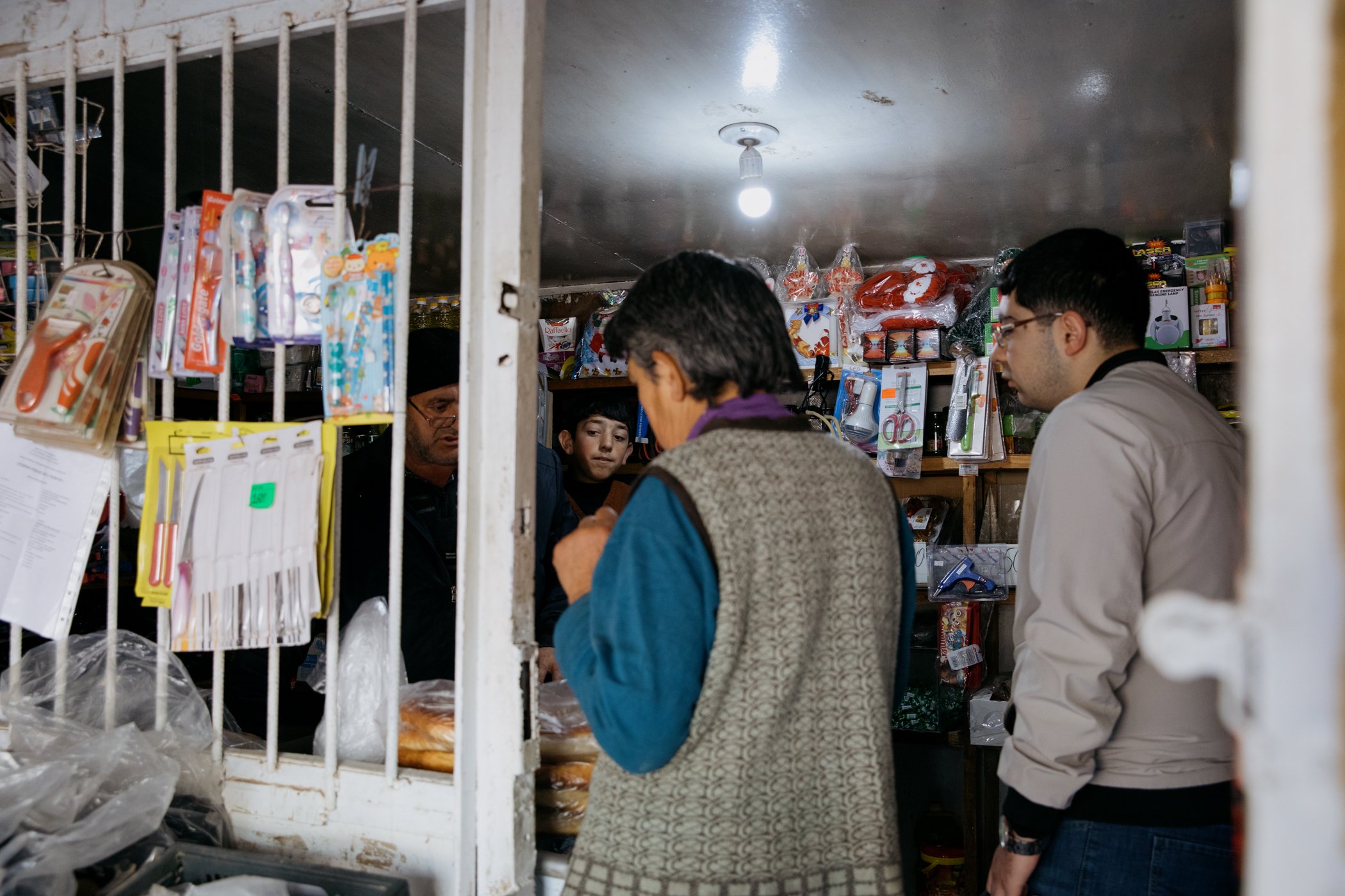  People inside Khnatsakh's village shop. 