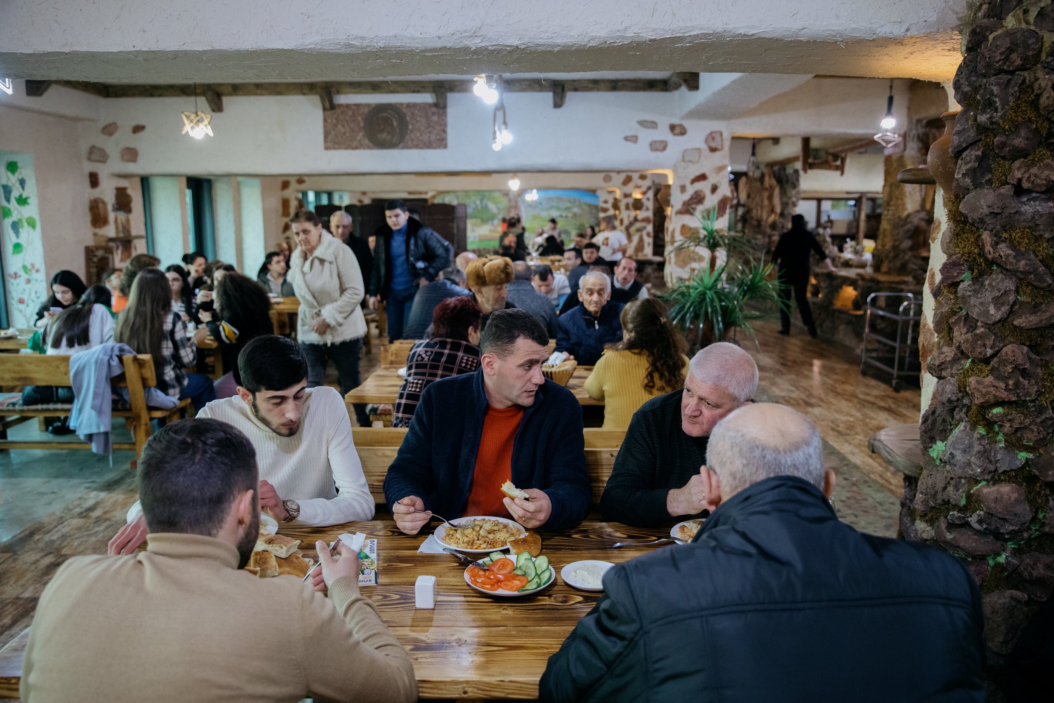  Residents of Nagorno-Karabakh eat dinner at the Hotel Goris. The Armenian government is covering the cost of accommodation for those who are unable to return home. The hotel is currently hosting around 150 people. 