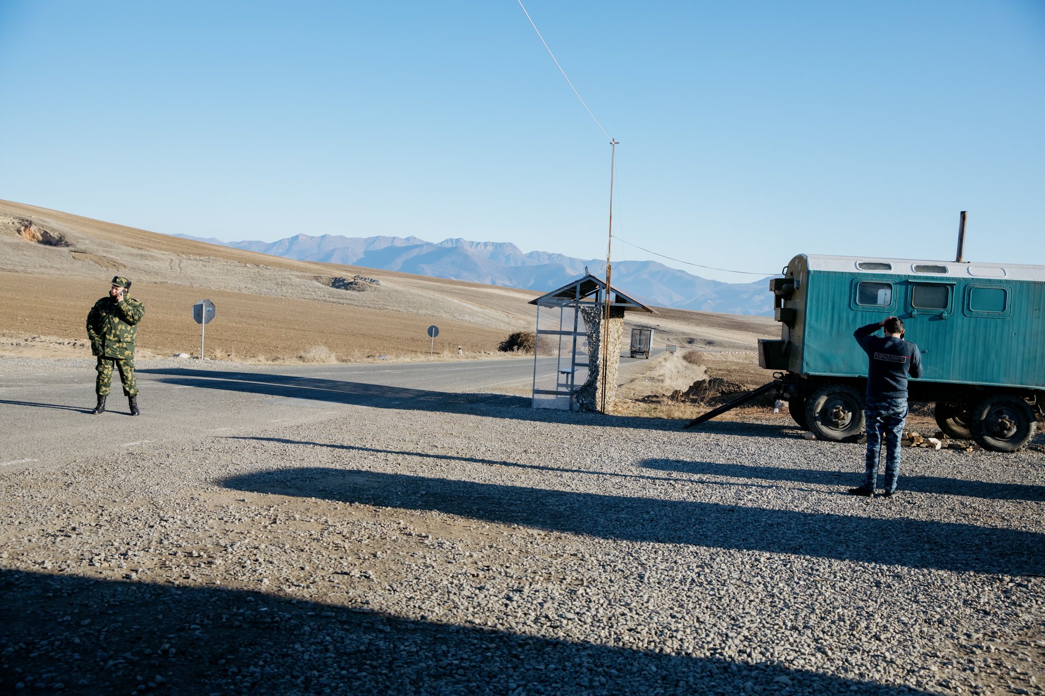  Armenian servicemen at the Tegh checkpoint. In the distance are the first hills of Nagorno-Karabakh. 