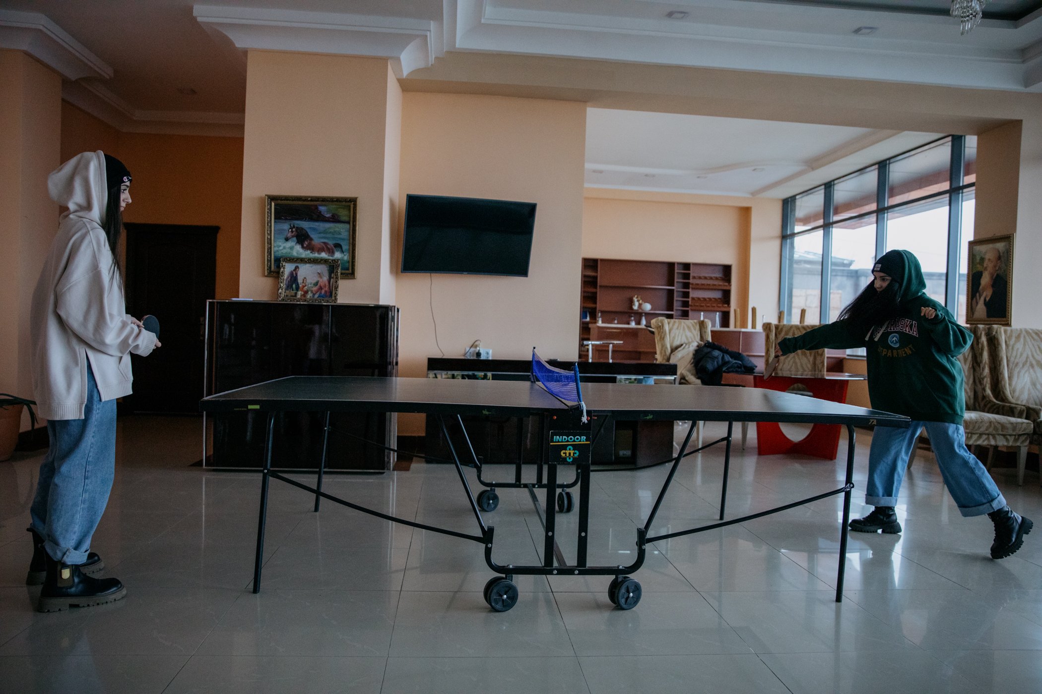  Two members of the Asparez dance group play table tennis in the Hotel Goris. 