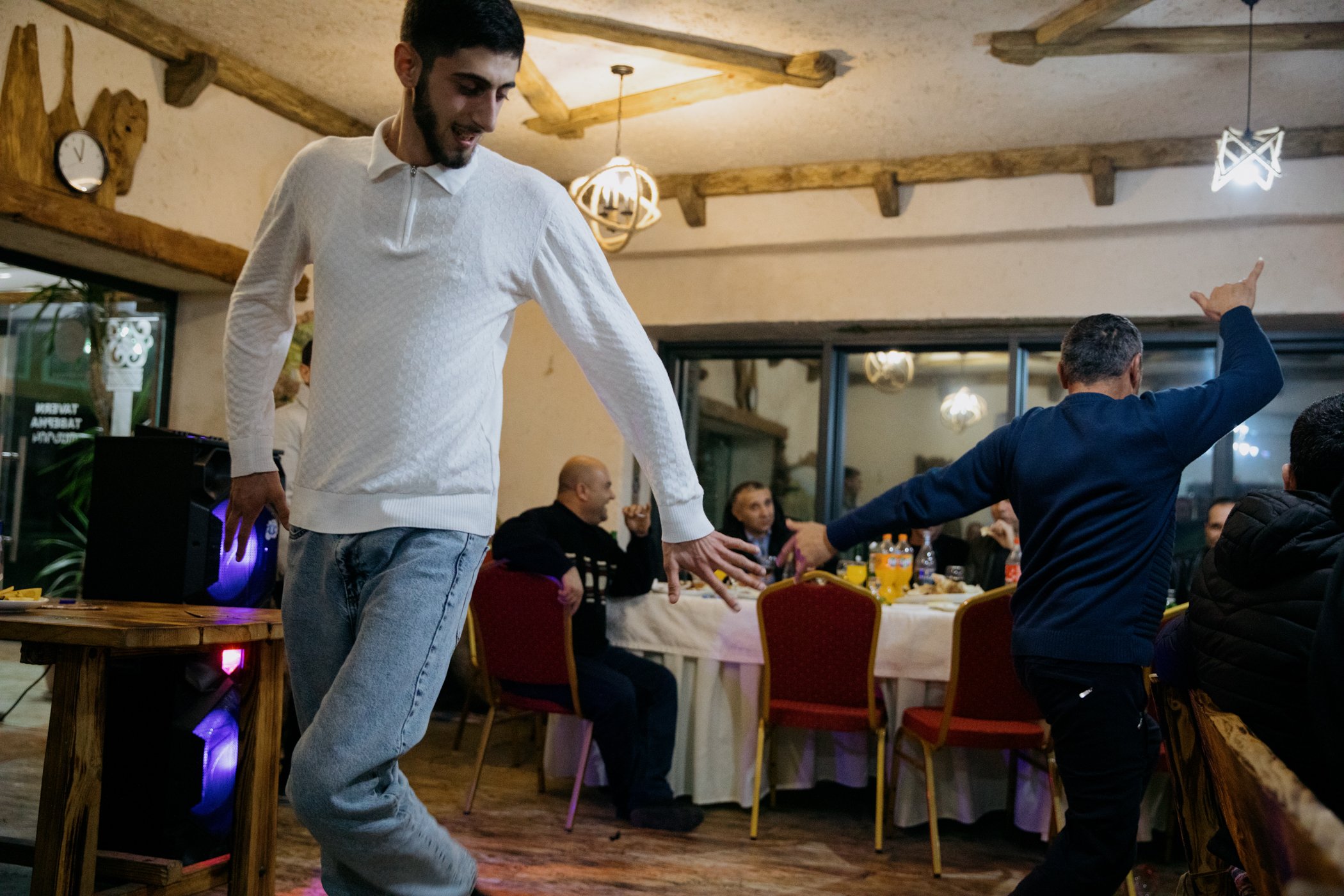  Men dancing after a New Year's Eve dinner at the Hotel Goris. 