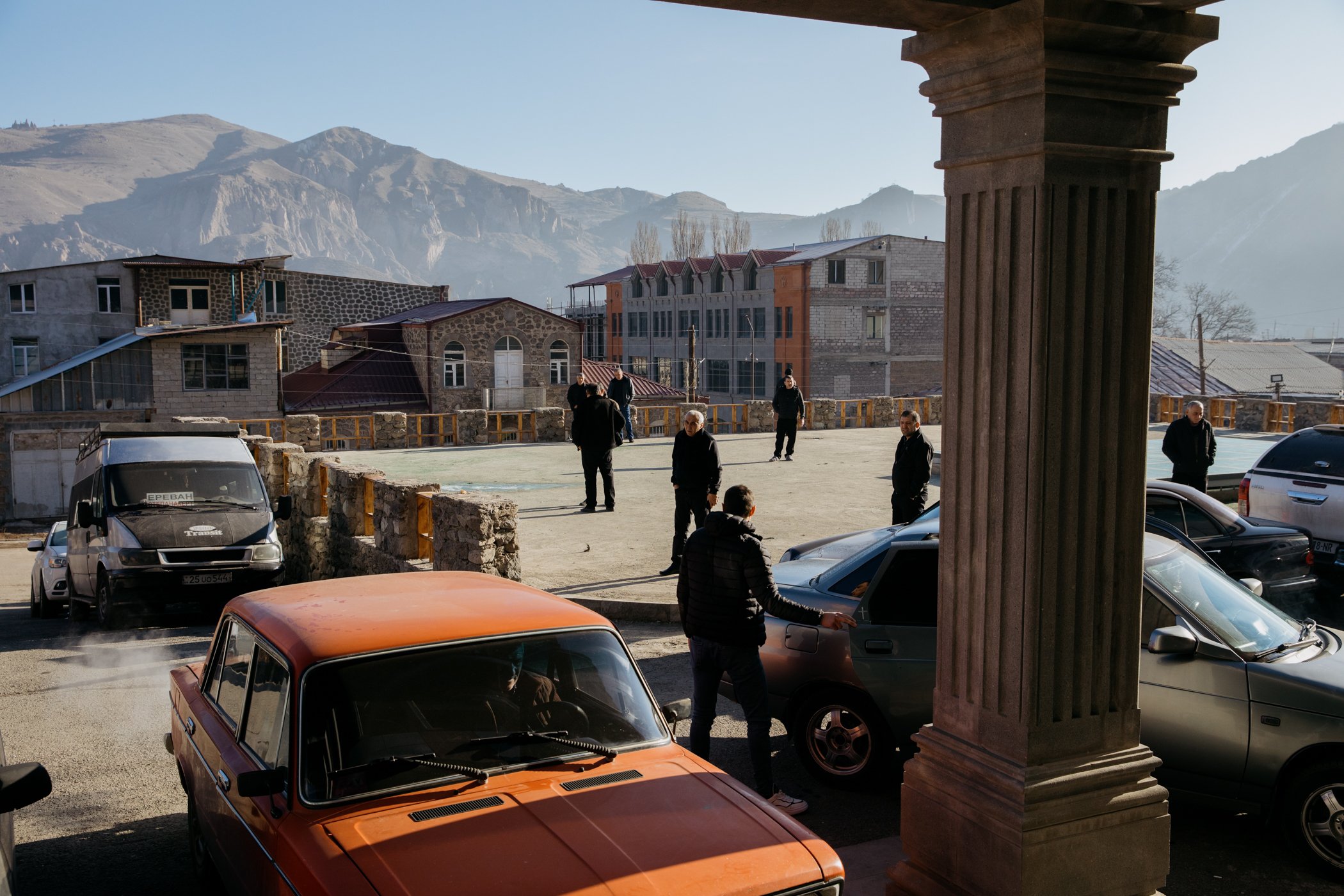  Guests at the Hotel Goris stand outside to smoke. 