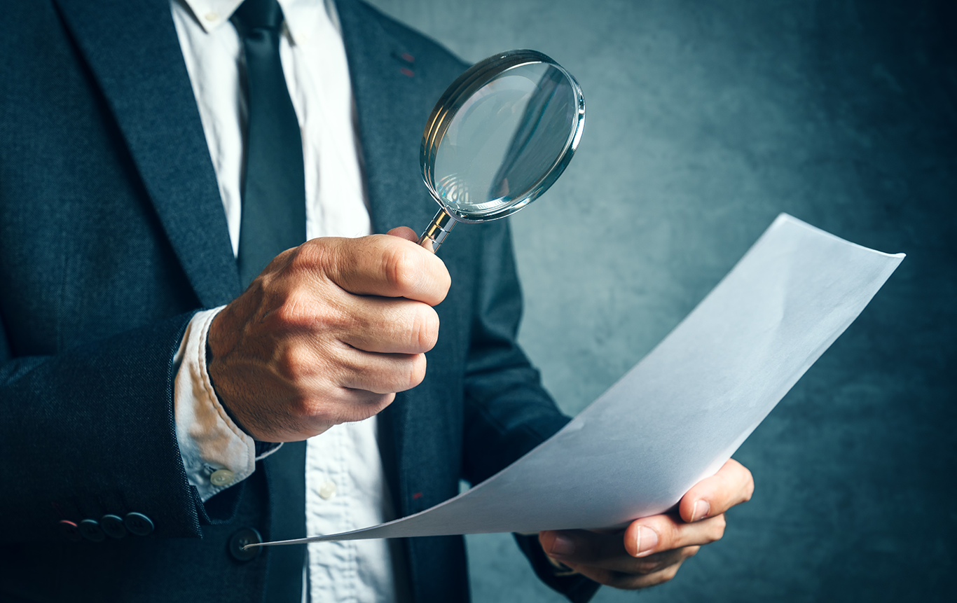 Guy-with-magnify-glass.png