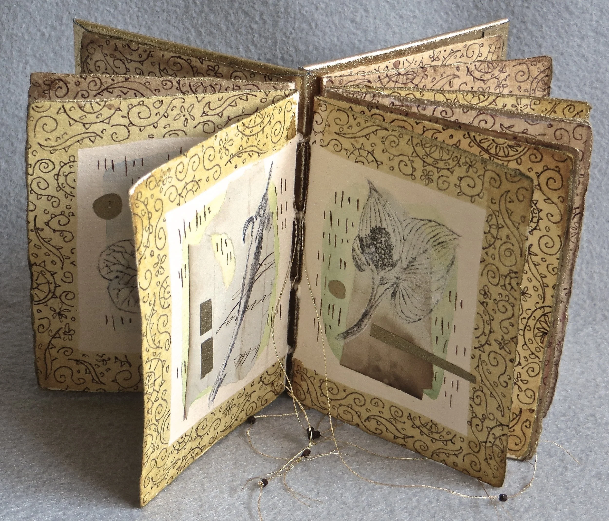  PRAYERS FOR THE GREAT SPIRIT’S GARDEN  Handmade linen/cotton paper, ink, paint, collage, thread, beads  4 x 3-1/2 x 1 