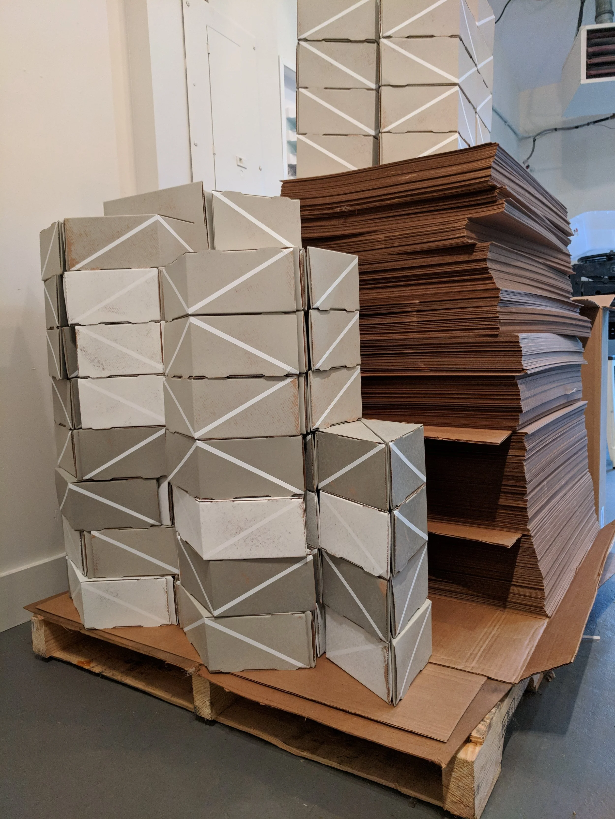 Process shot of modular cardboard forms in studio