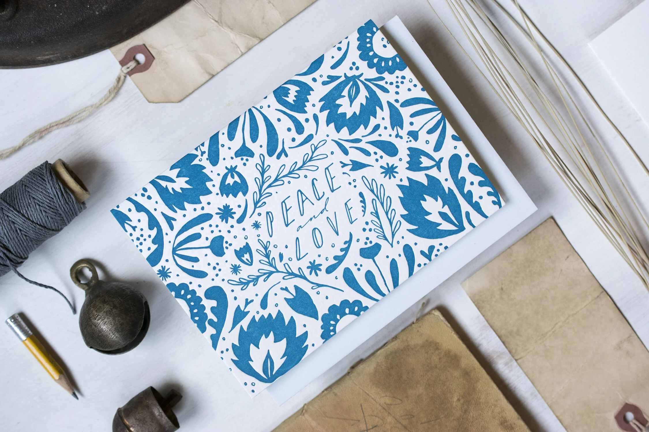 Blue and white greeting card reading, peace and love