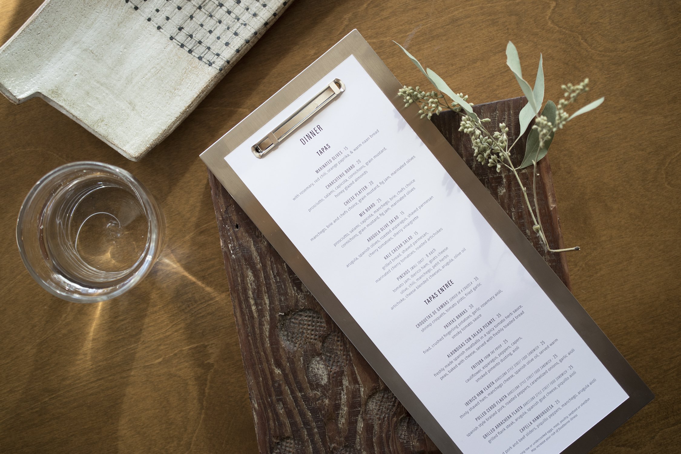 Restaurant menu in stainless steel holder