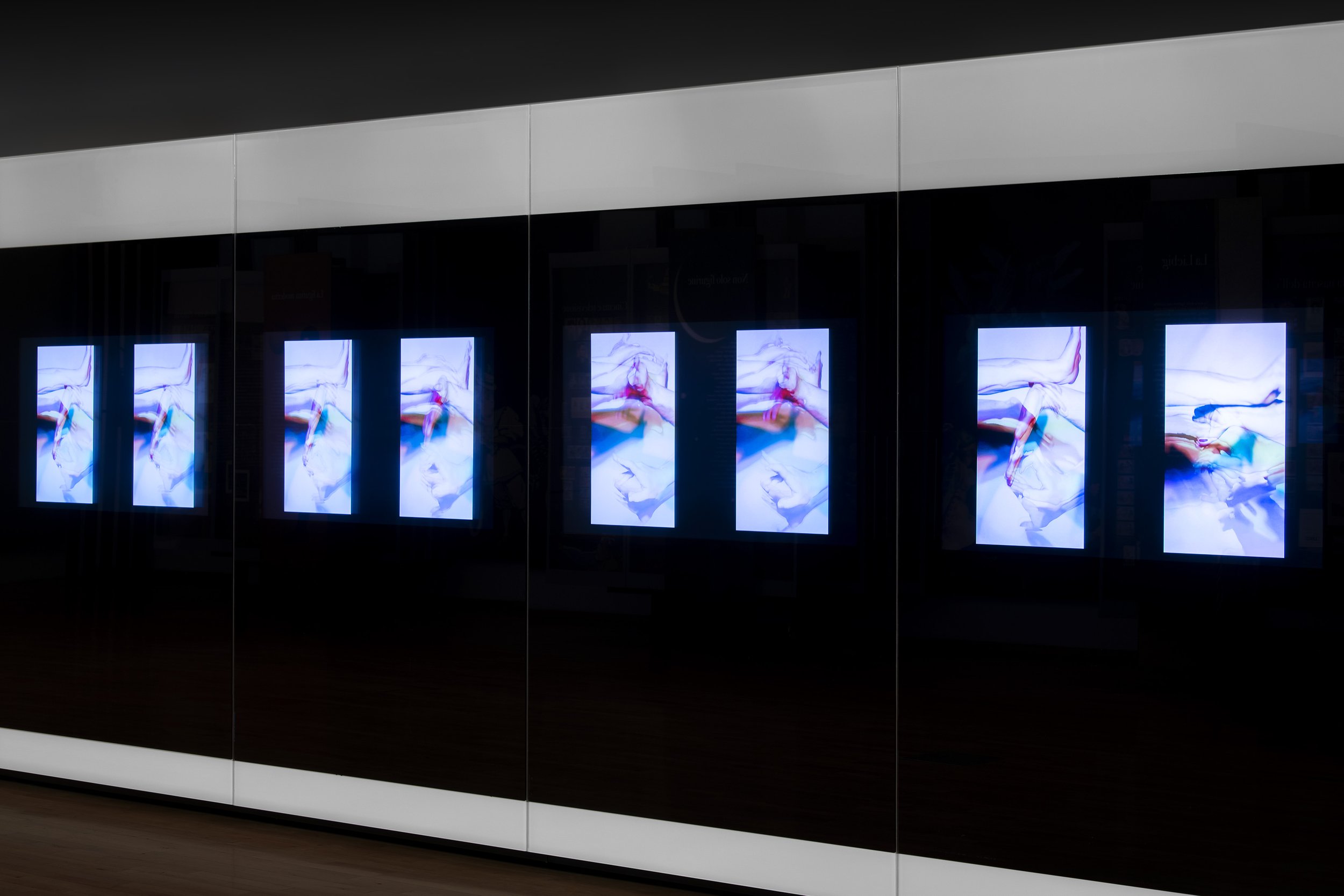 Scenographic display combining 19th-century chromolithographic collectible cards with contemporary images sourced from social networks inside the Finger Plays exhibition.