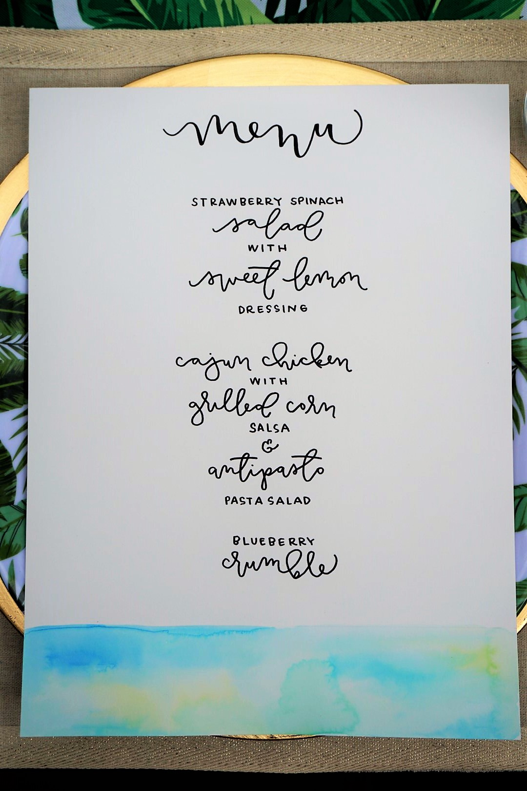 Beautiful calligraphy summer dinner party menu with watercolor accent.