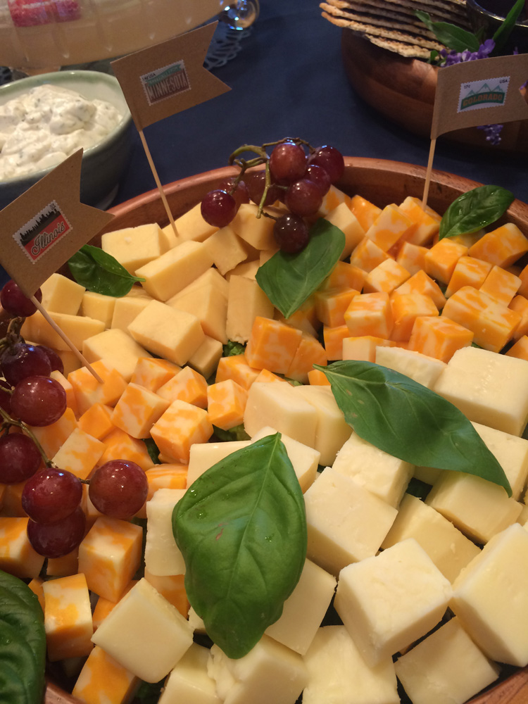  Cheese cubes with state toothpick flags in them for a travel themed bridal shower. 