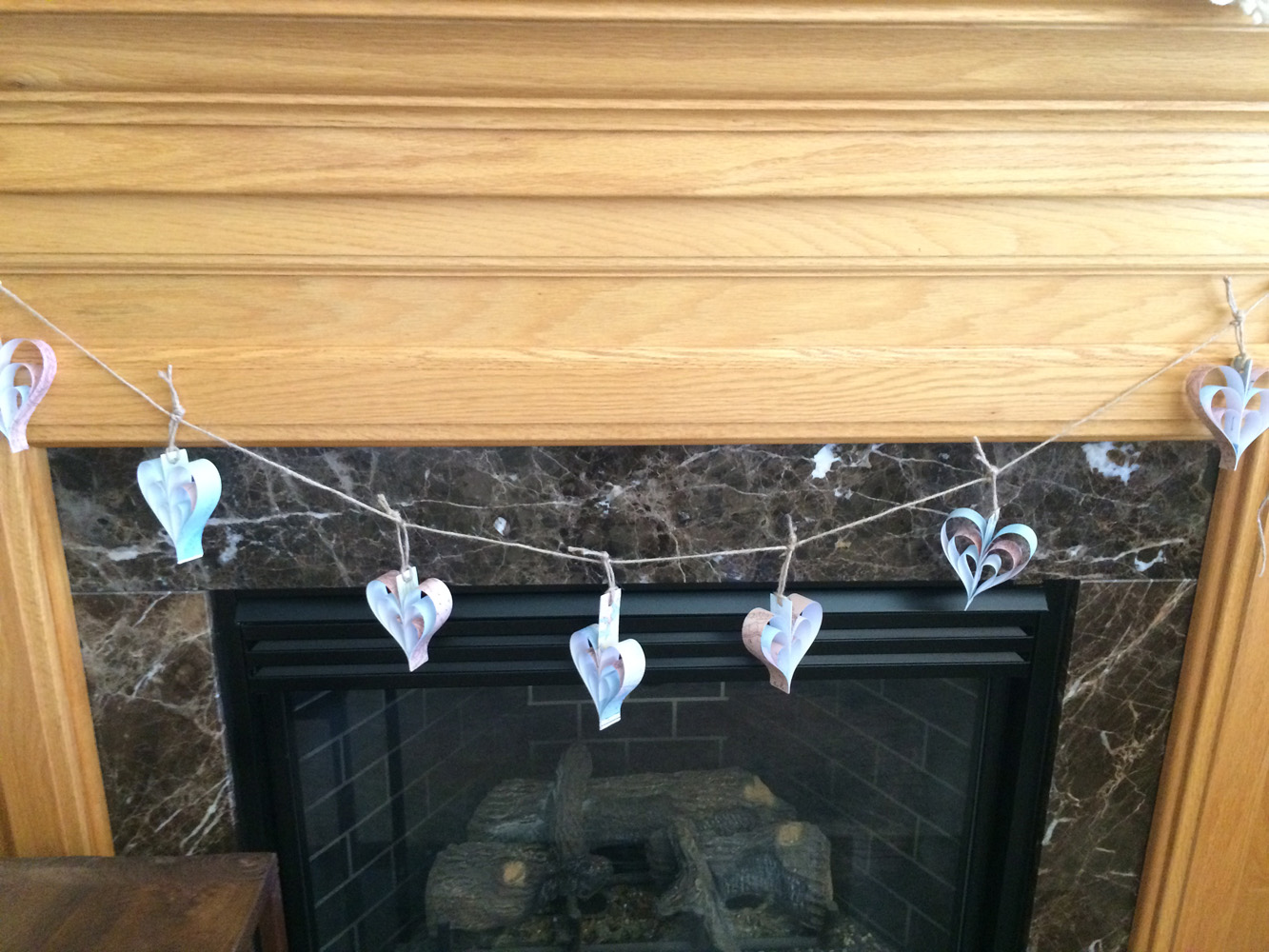Use vintage maps or map paper to create a heart garland for a travel themed bridal shower.