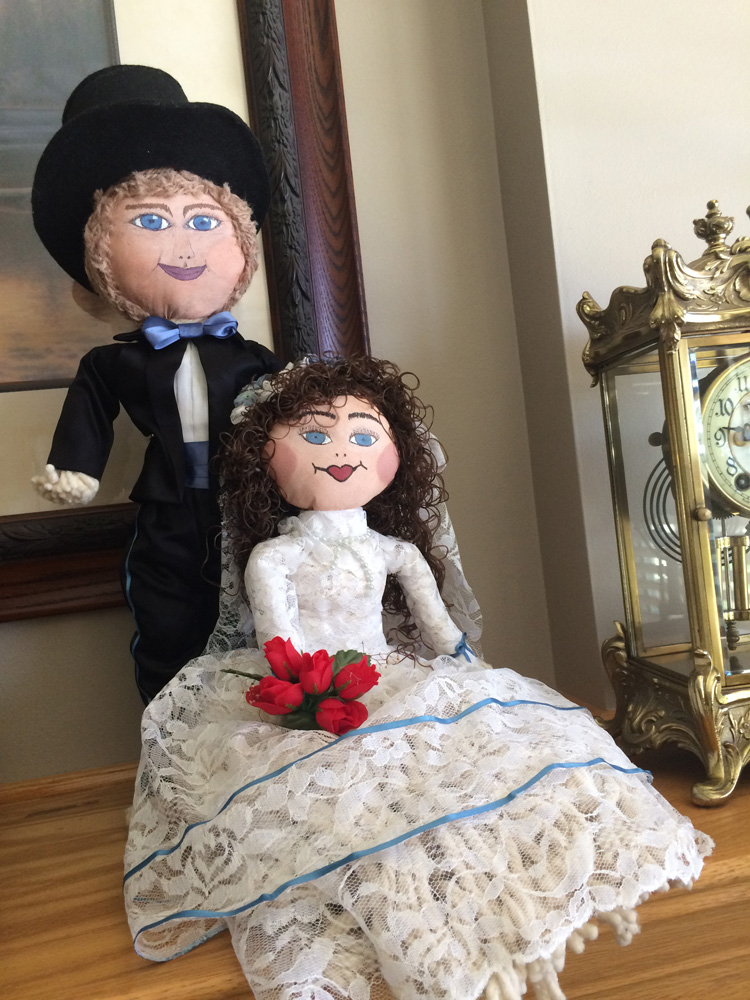  Handmade bride and groom dolls made by the groom’s grandmother. 