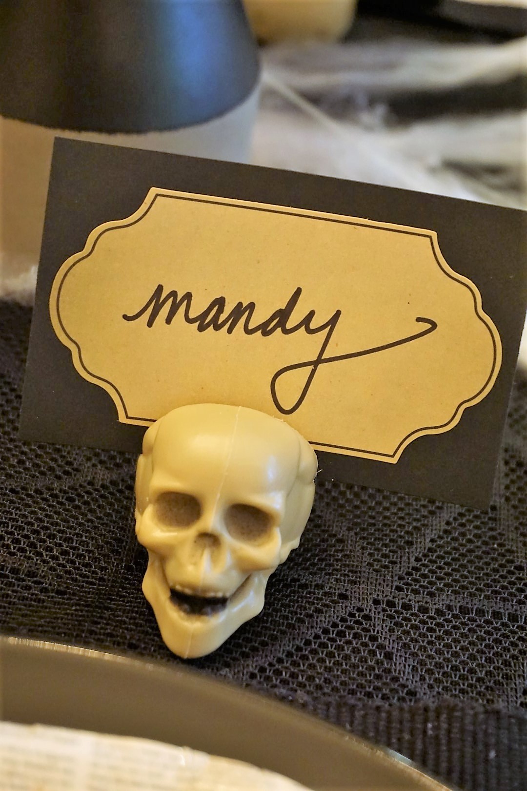  How fun are these DIY place cards? Use a Dremel to transform Dollar Tree skulls into place card holders. Click here for the full tutorial! | Legally Crafty #halloweendiy #halloweentable #halloweentablescape #halloweendiy 