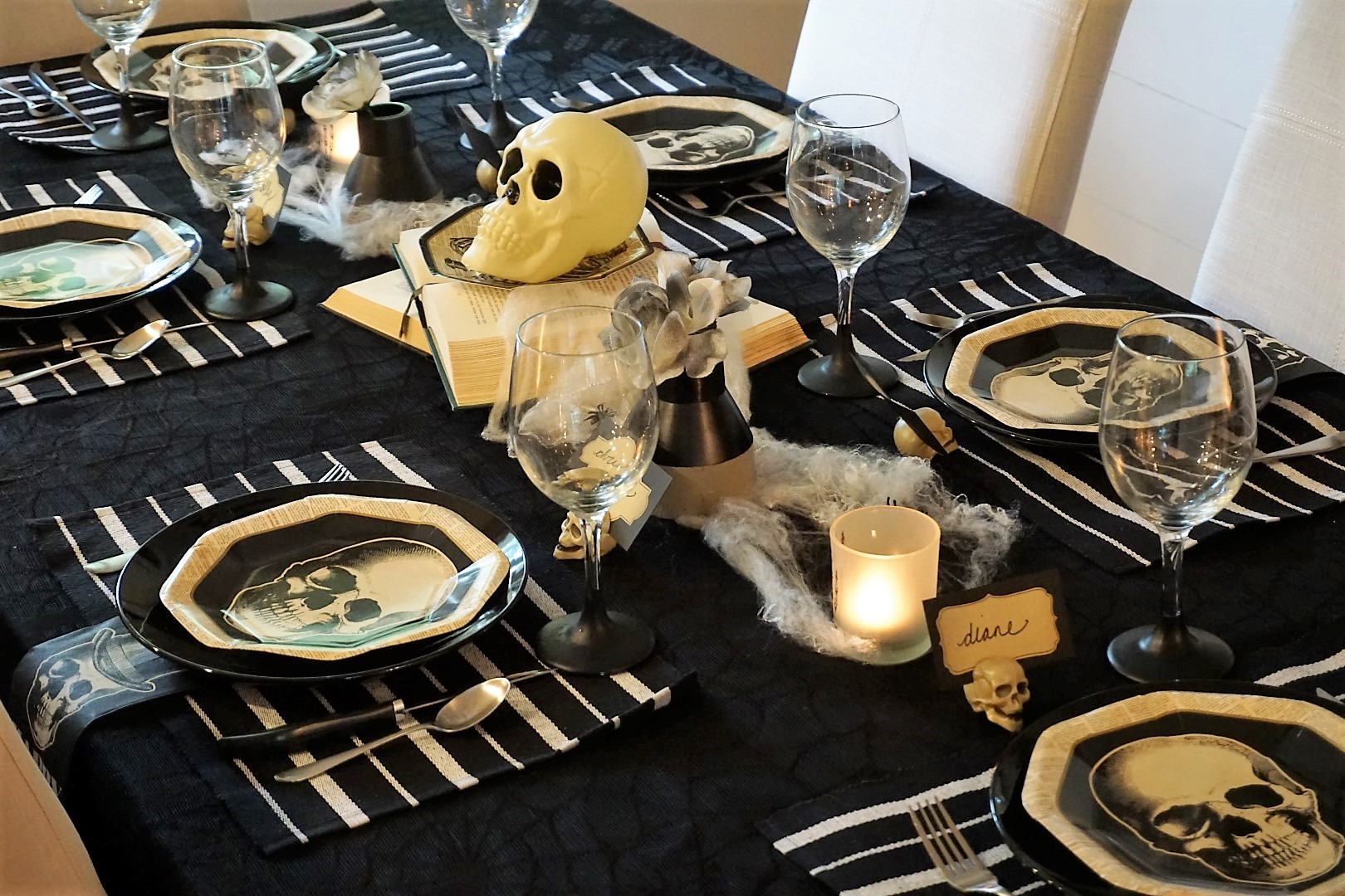  Spooky chic doesn’t have to be expensive. Click here to see how to re-create this Halloween table! | Legally Crafty #halloweentable #halloweendiy #diyplacecards #halloweendecor #halloweendinnerparty 