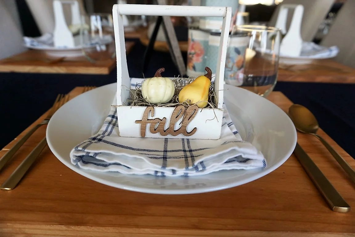  Fall wood word cut out at table setting. 