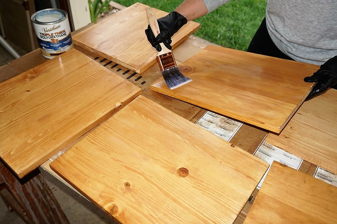  Apply polyurethane with paint brush to seal wood chargers. 