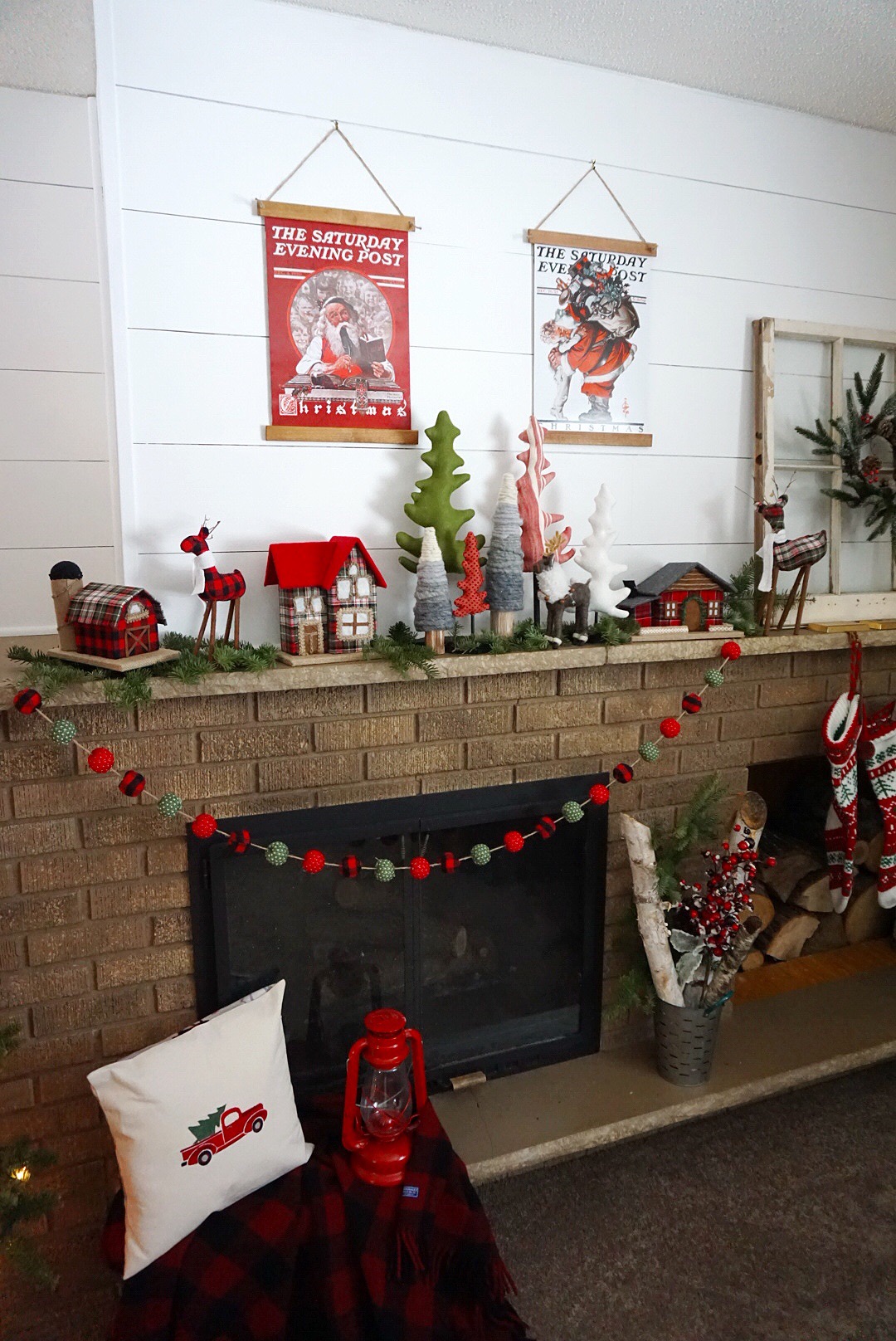  Christmas mantel with DIY vintage poster frames and classic plaid decor. 