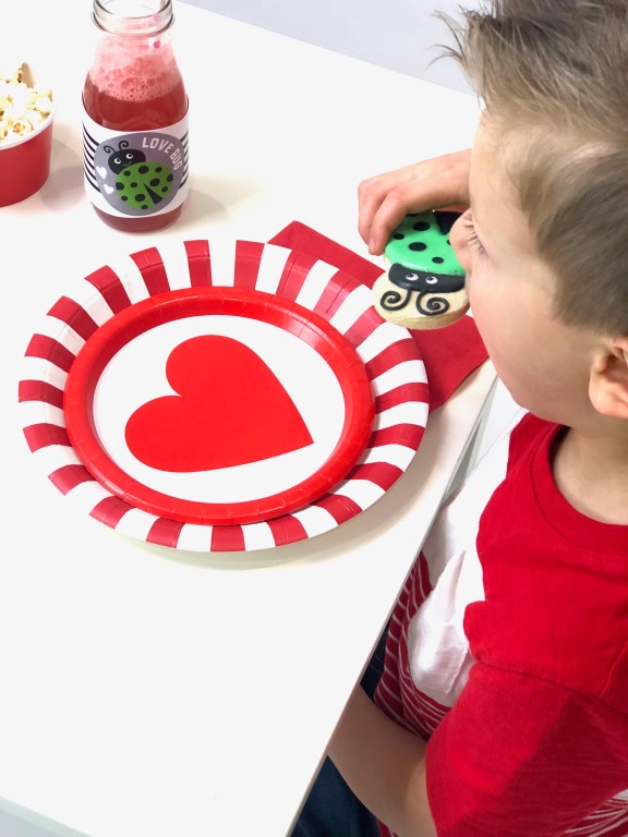 Red and white striped plates layered with heart cake plates make an easy place setting.