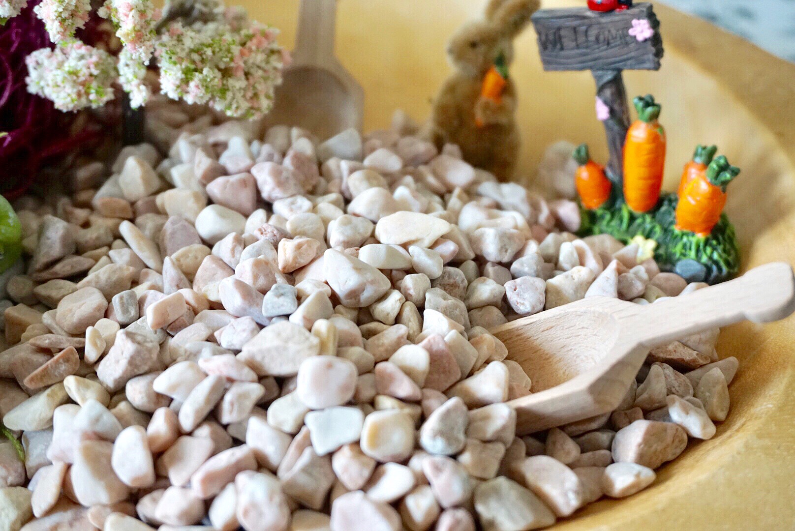 Pink rock from Michaels makes a great base for DIY mason jar fairy garden terrariums.