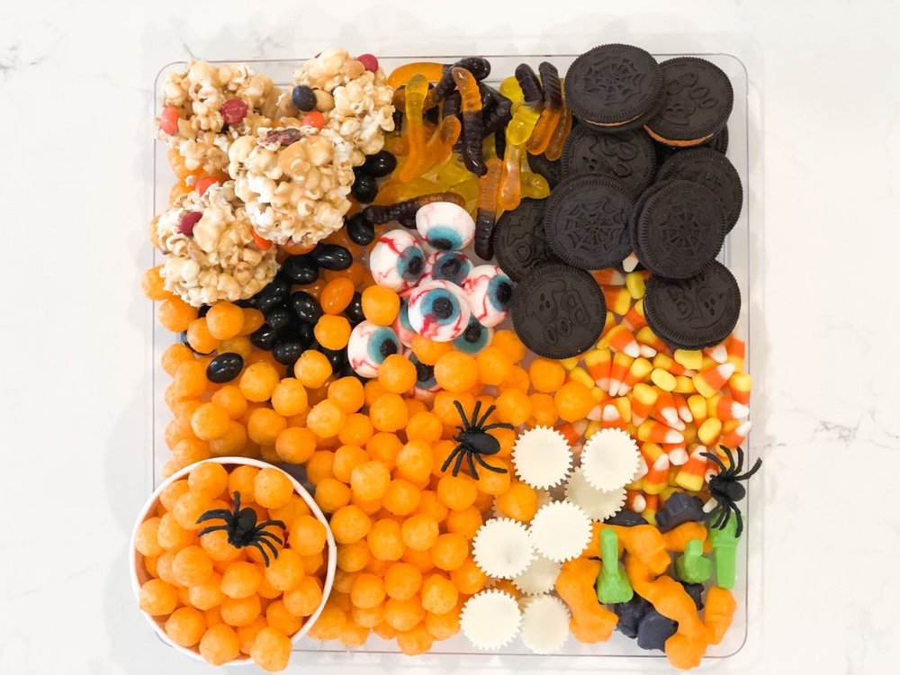  Halloween charcuterie snack board with candy and cheeseballs 