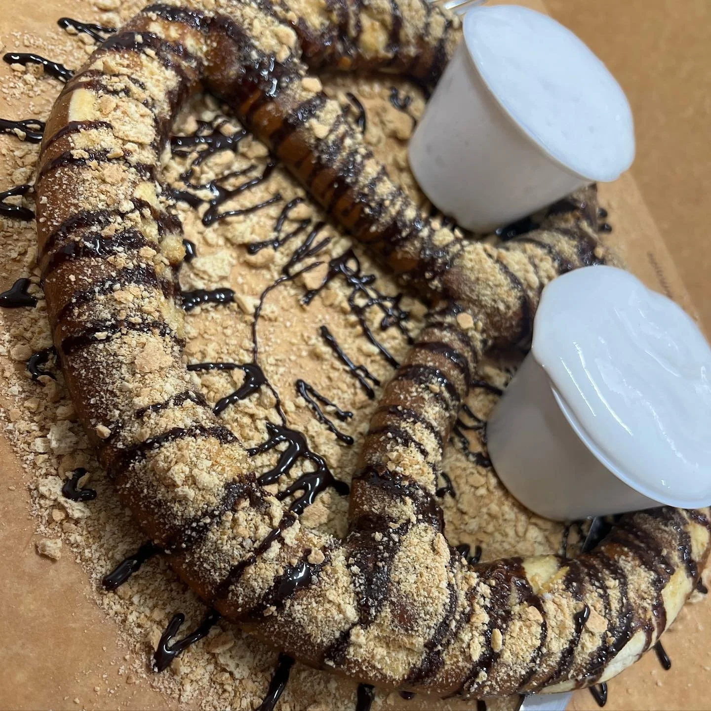 Saturdays Call for New Pretzels! Come Try the New S&rsquo;mores Pretzel! 
.
A Giant Hand Twisted Bavarian Pretzel with a Graham Cracker Crust and Chocolate Drizzle. Served with Marshmallow Fluff.
.
It&rsquo;s delicious! Just ask these two cute young 