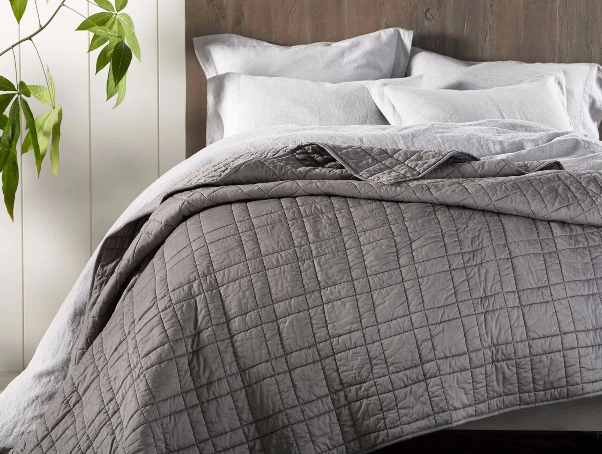 double stitched organic cotton comforter on bed.png