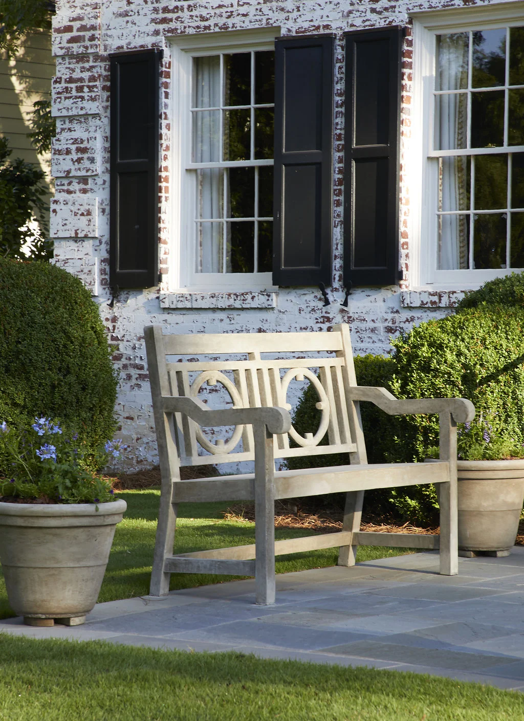 Custom bench between custom pots made for this home.