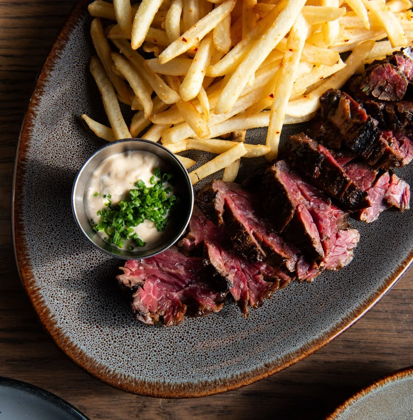 NEVER NOT A STEAK FRITES KINDA DAY.

Ours is a marinated hanger steak in fermented black bean paste, ginger, garlic, and sesame oil, and served with a miso remoulade and fries dusted with gochujang pepper flakes.

Dinner starts at 5pm. We&rsquo;ll se
