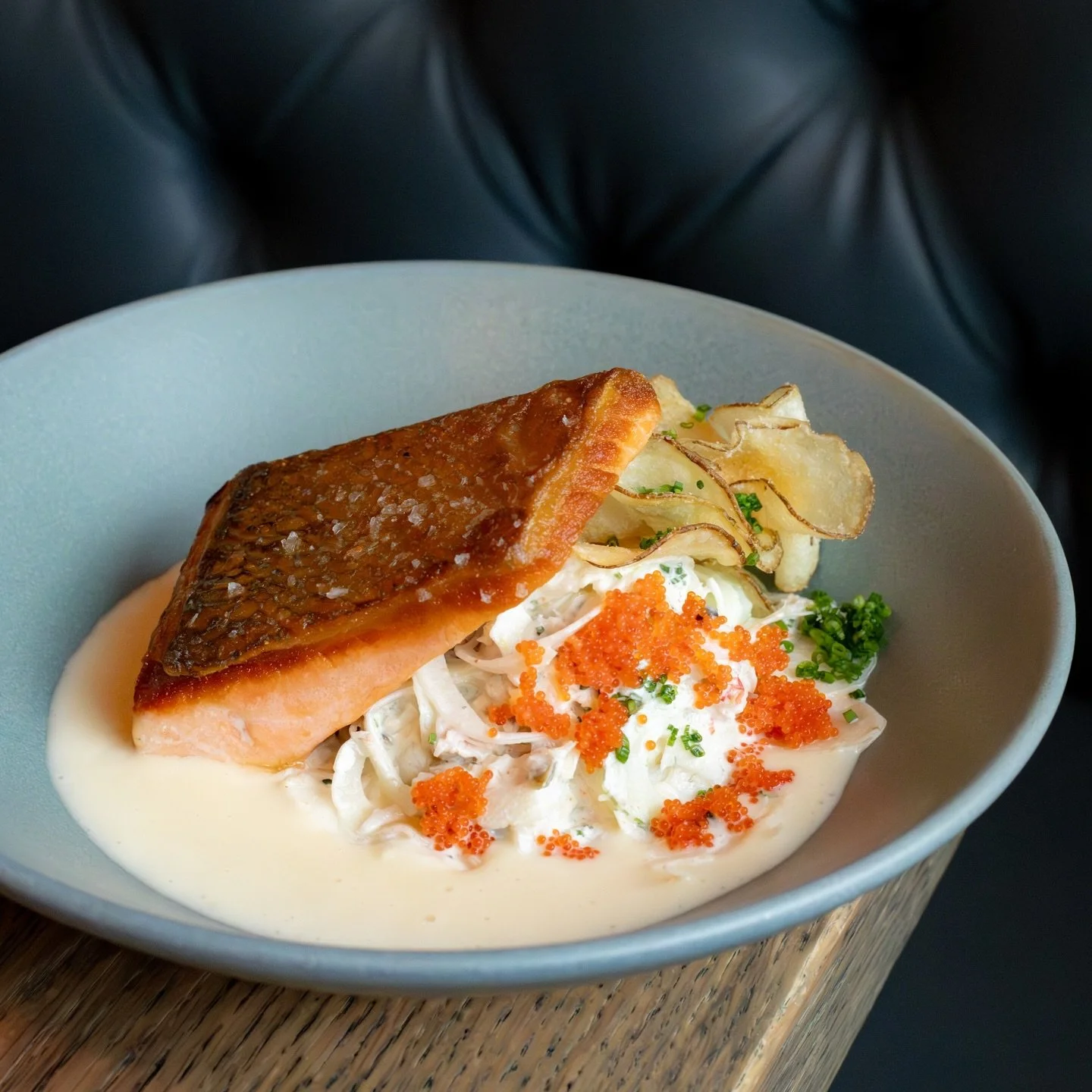 A dish fit for a king 👑⁠
⁠
Seared King Salmon with potato veloute, fennel &amp; crab salad, and yuzu kosho⁠ remoulade, garnished with crispy salt &amp; vinegar chips, bright and briny tobiko, and fresh chives.⁠
⁠
Stop by and give it a try. We&rsquo;