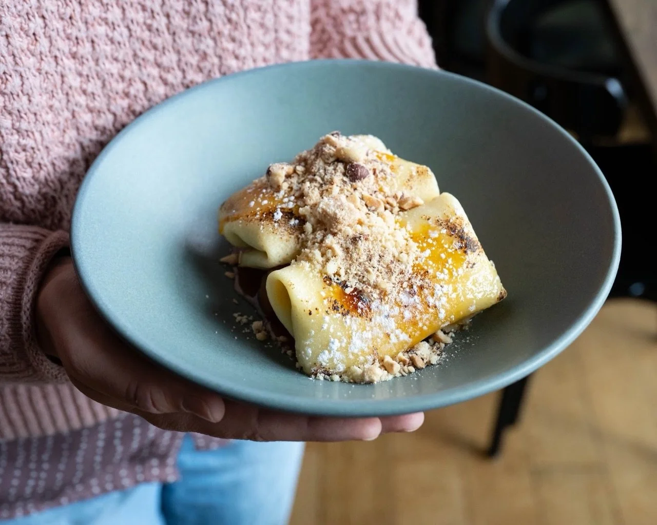 Silky crepes filled with Calvados pastry cream then bruleed for a delicate crunch, served alongside apples that have been cooked down in a miso caramel sauce, and hazelnut streusel.&nbsp;

The final touch? A generous pinch of Maldon salt.

Sweet, tex