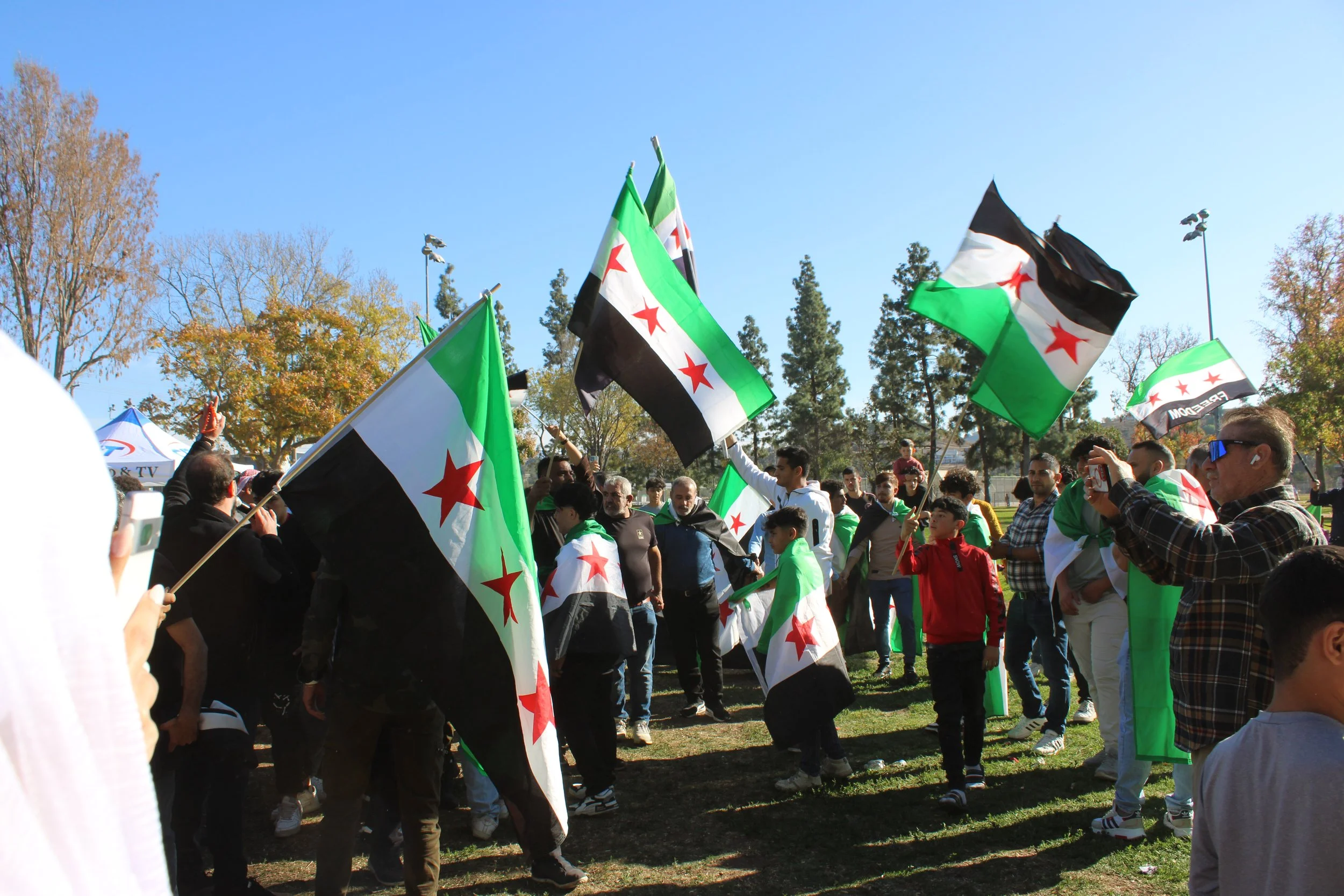 Local Syrians celebrate fall of Assad regime; some will wait to visit Syria again