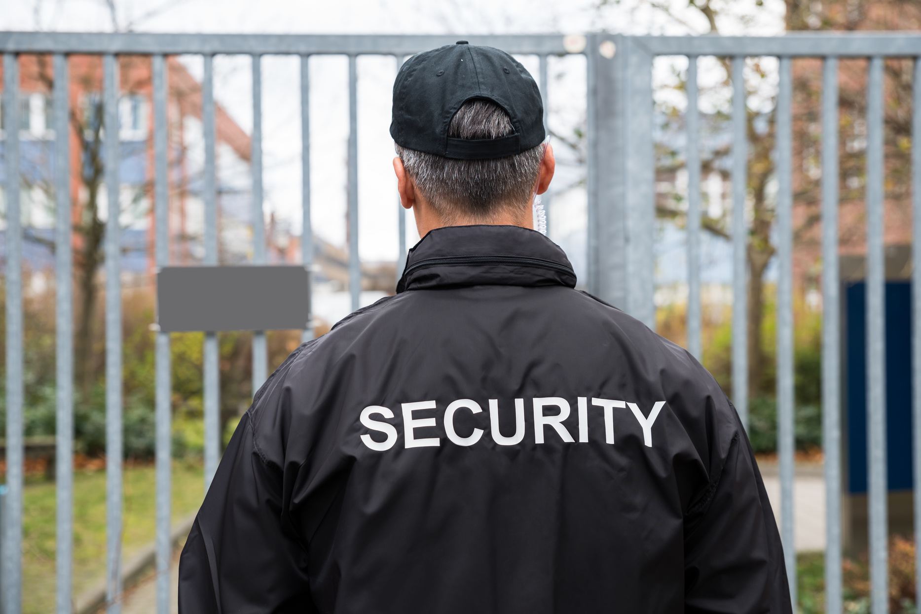 059386759-rear-view-mature-security-guar.jpeg
