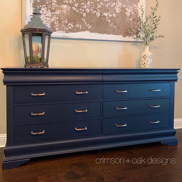 Finally sharing the full reveal photos of this buffet/sideboard I custom painted for a client over the summer. This navy blue beauty started out as a bedroom dresser but now, after a sleek paint job and gorgeous new transitional drawer pulls, fits ri
