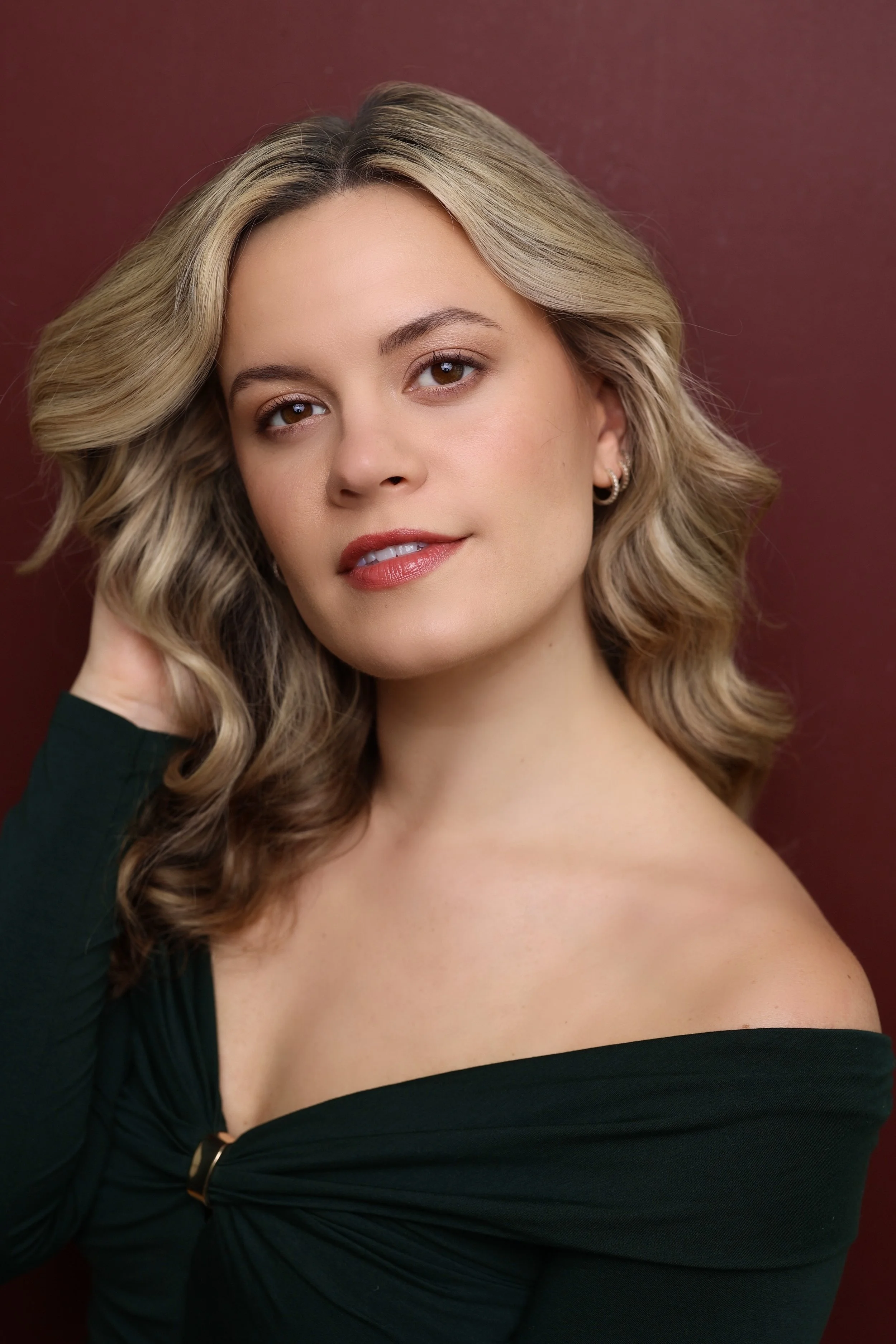 Blonde woman in green top headshot