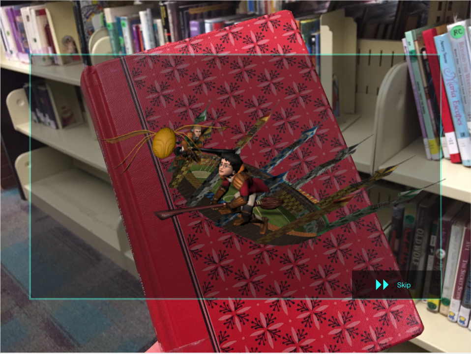 In this iteration, the user looks at the cover and triggers a short clip or trailer of the book.