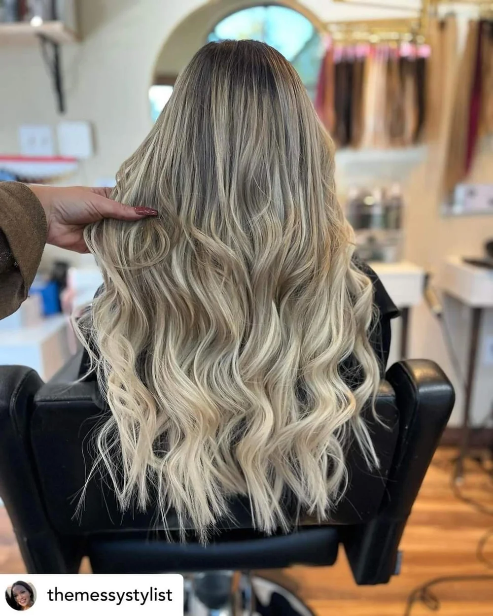 Long blonde extension work by Asia, with original @themessystylist mark