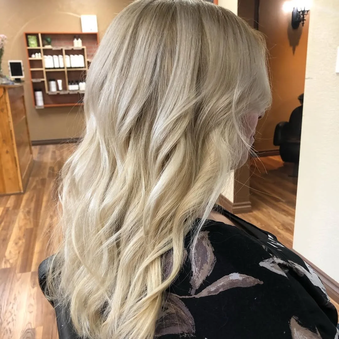 After, blackhole roots gone! Lifting her roots blonde, plus a root drop for some depth. Glossed with p-32 from Oligo Professional for Champagne tone!