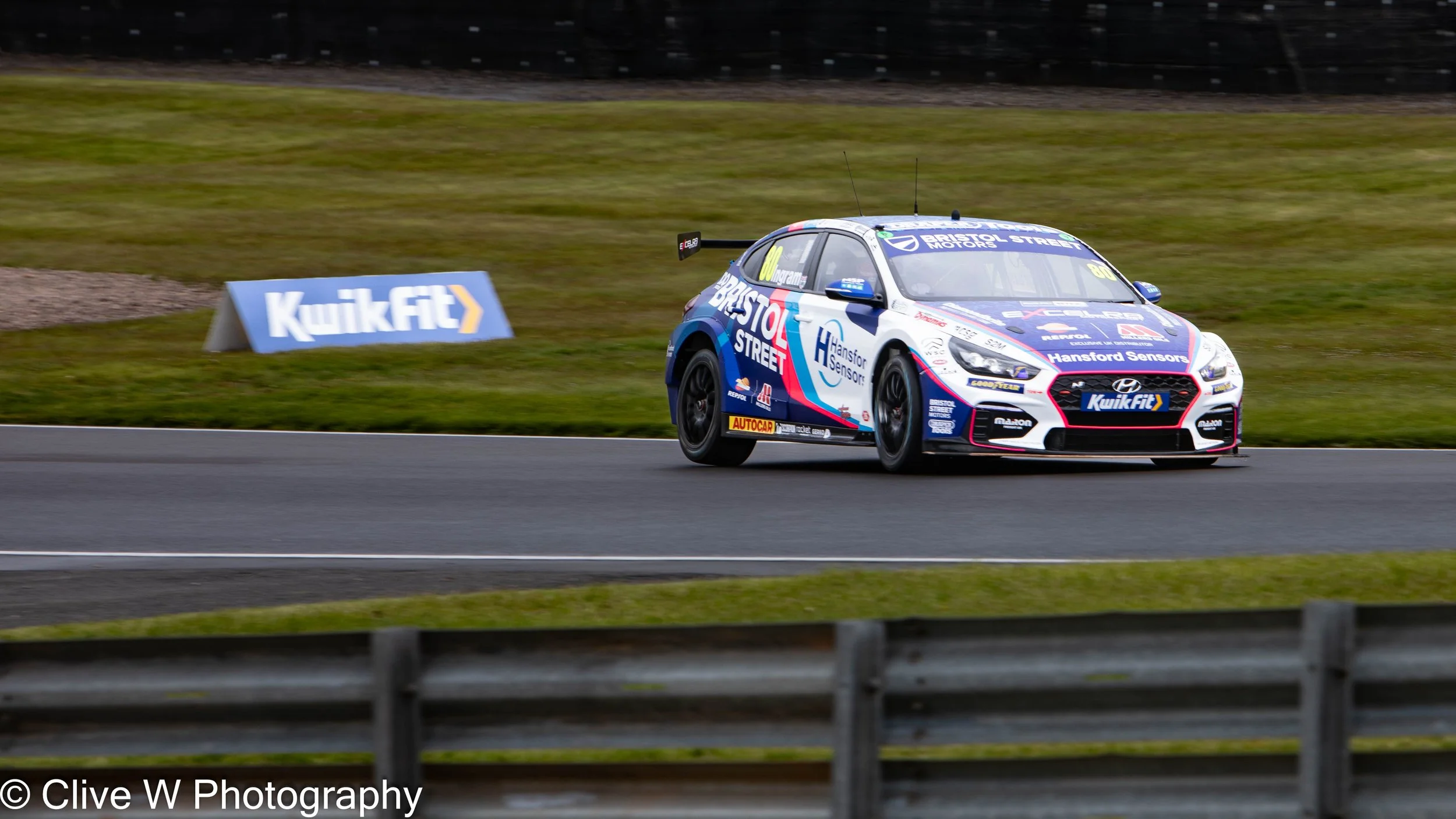  A wet Donington Park race, BTCC with Tom Ingram,.   Date: 24th April 2024    Taken: f5.6, 1/125 sec iso 100 @ 400mm    With: Canon 5D mkIV and 70 - 200mm f2.8 + 2x extension.  