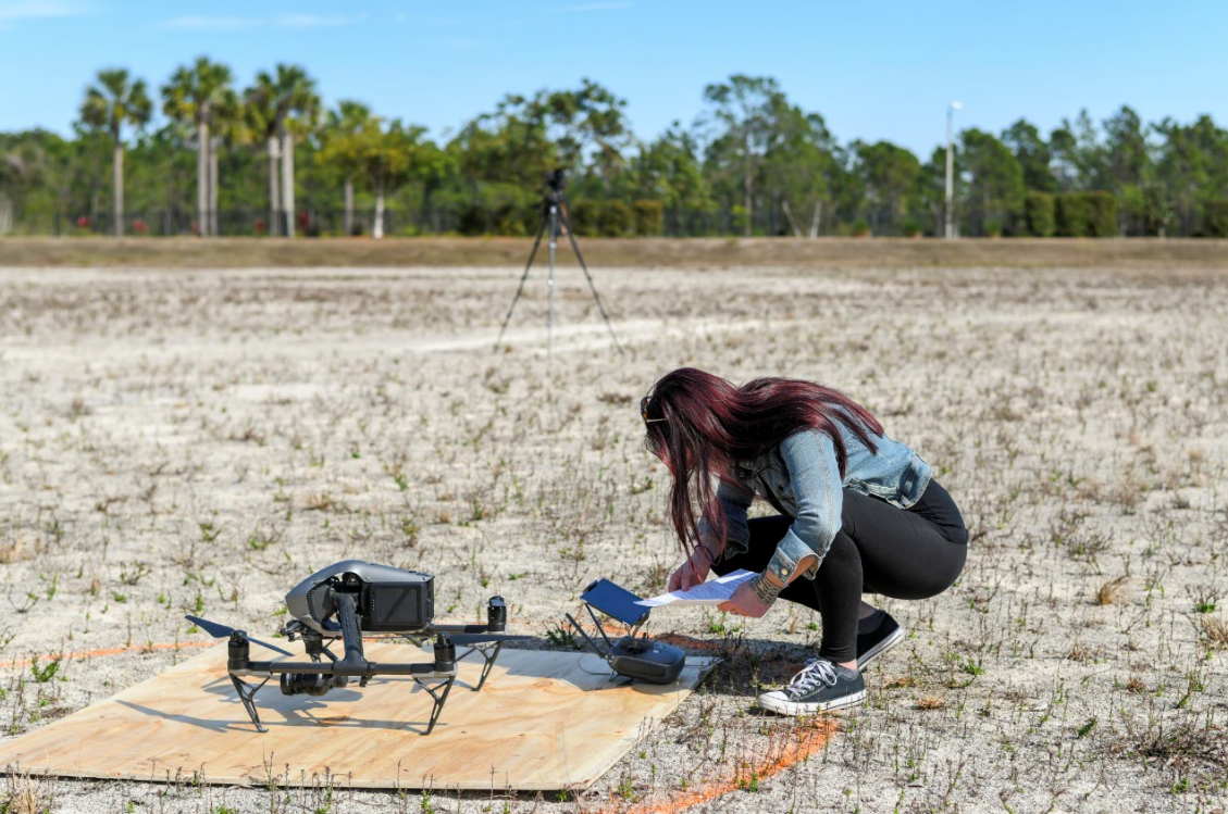 nicole abbett with drone.PNG