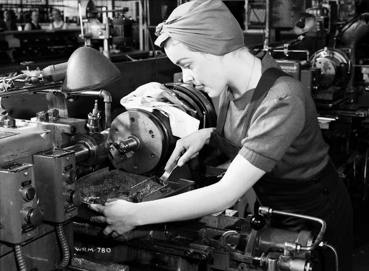  Veronica Foster, an employee of John Inglis Co. Ltd. known as "the girl with the machine gun", leads a lathe on the production line of Bren machine guns 