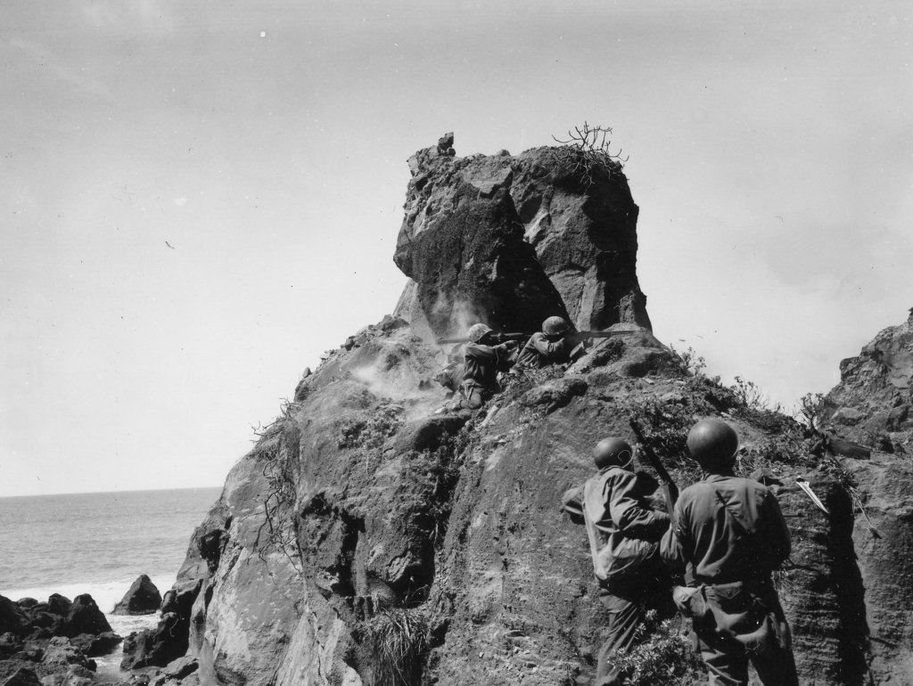 US Army Soldiers from the 147th Infantry engaging heavily fortified Japanese positions
