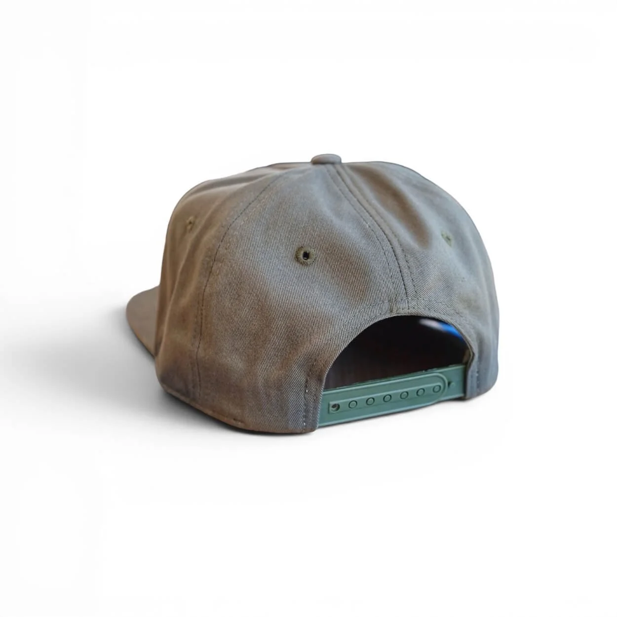 The back of an olive cotton snapback hat with ‘Gulf Coast’ orange embroidered patch, flat brim, studio product photo.