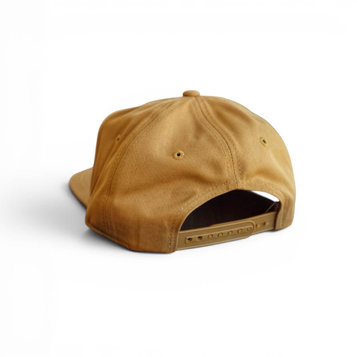 The back of a caramel cotton snapback hat with ‘Gulf Coast’ orange embroidered patch, flat brim, studio product photo.