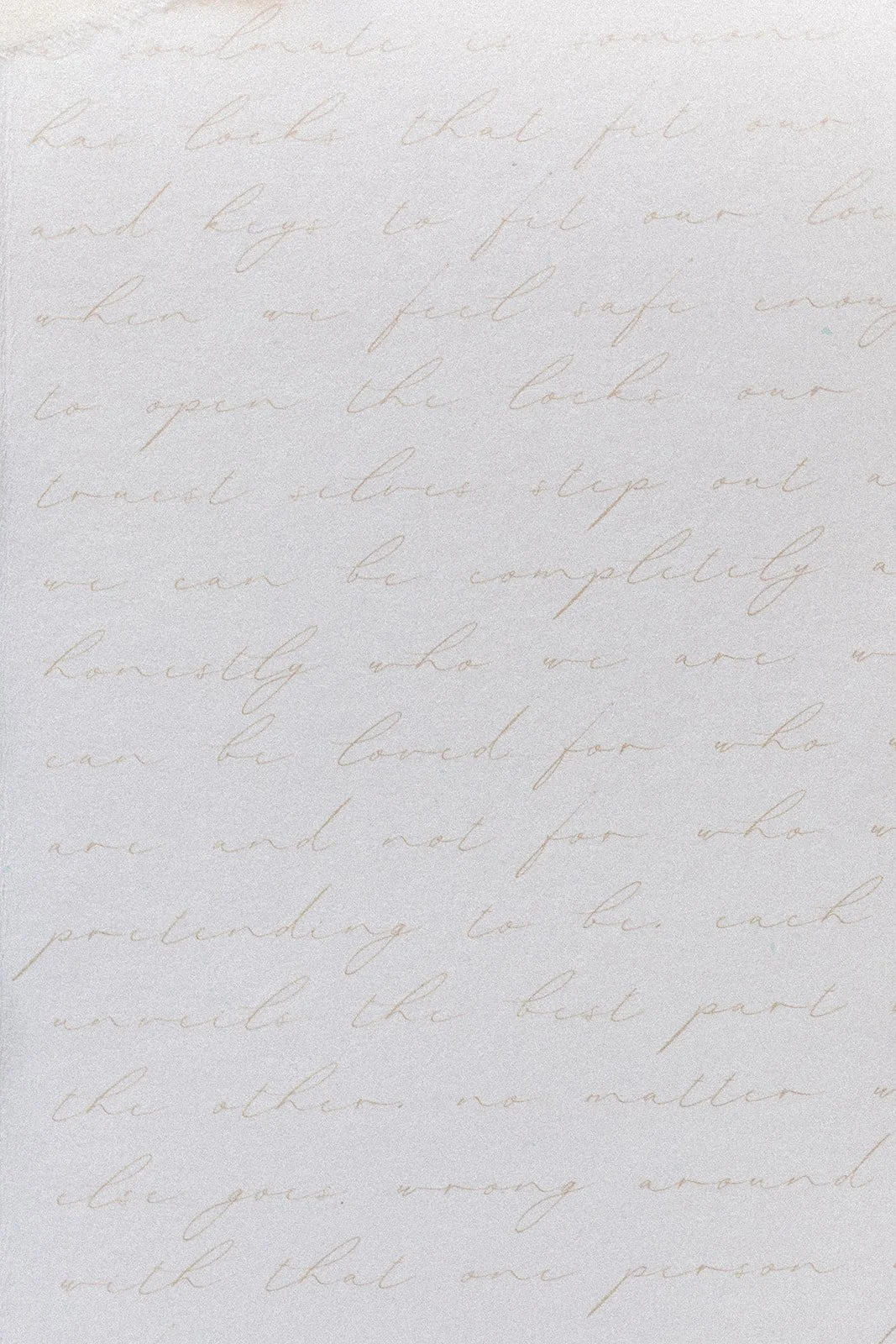 Faint handwritten cursive text on a light background.