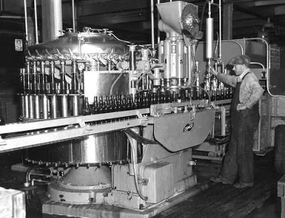 Lethbridge Sick's Brewery, view of the beer bottle assembly line. Courtesy the Galt Museum & Archives: P19752209038.