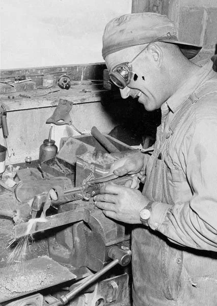 Andrew Briosi welding in his shop. Courtesy Galt Museum & Archives: 19752990127